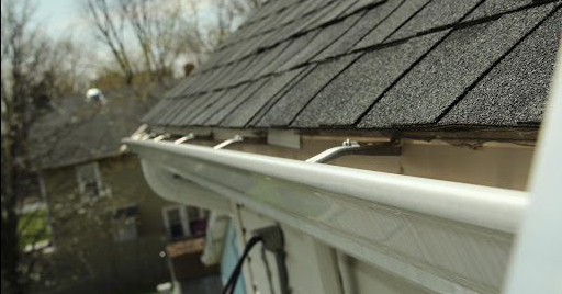 gutters attached to roof on a residential building